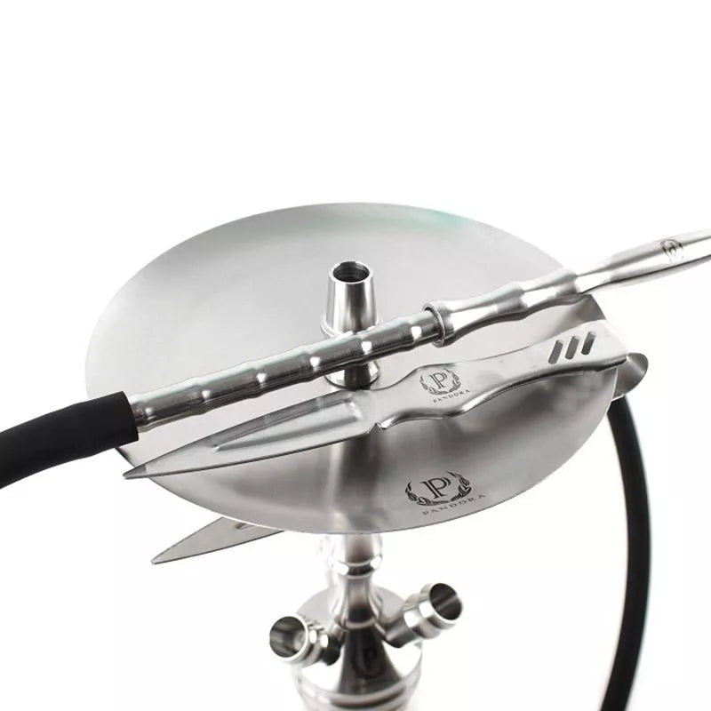 Close-up of a metallic hookah bowl with a black hose on a white background